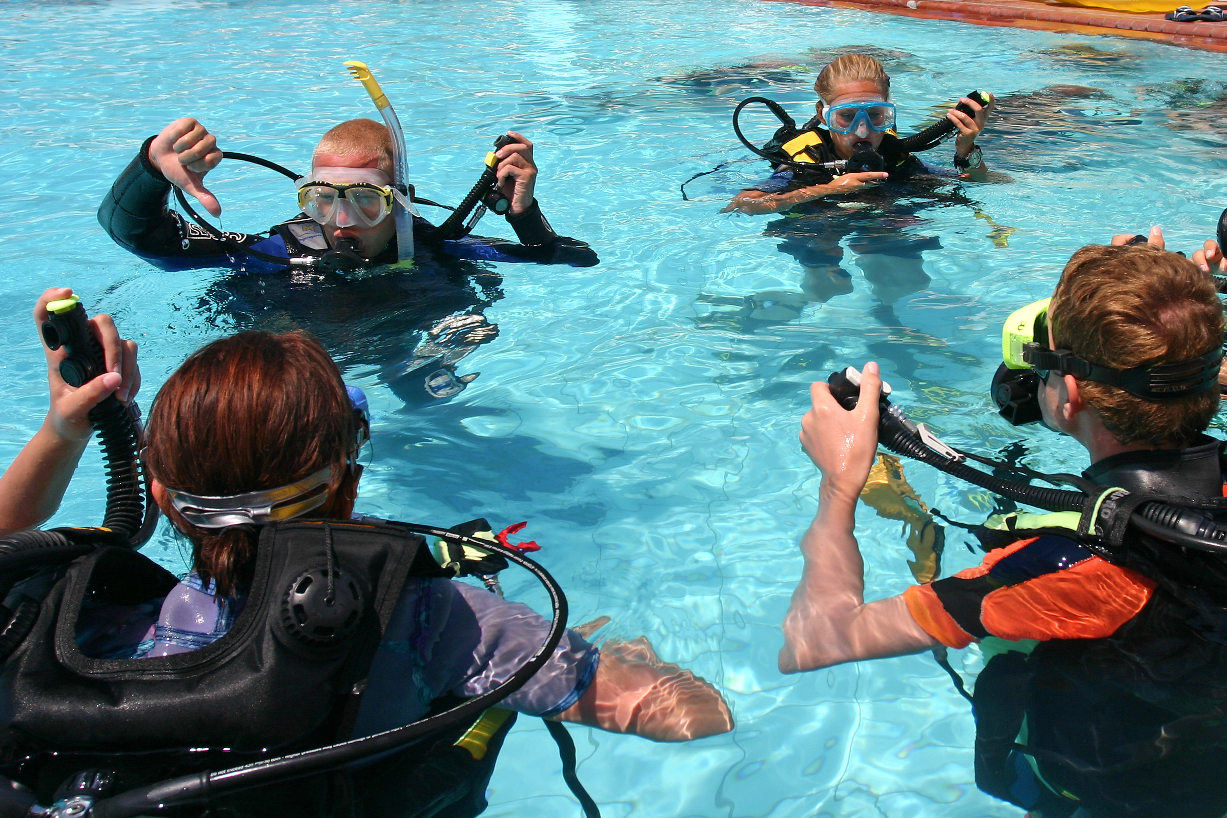 Scuba Divers Training in a Pool
